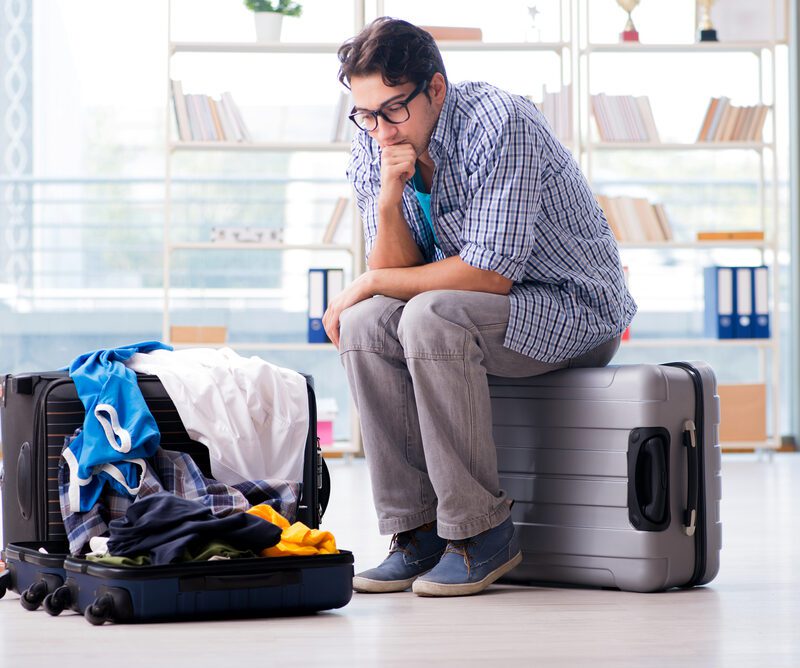 Young man experiencing travel anxiety